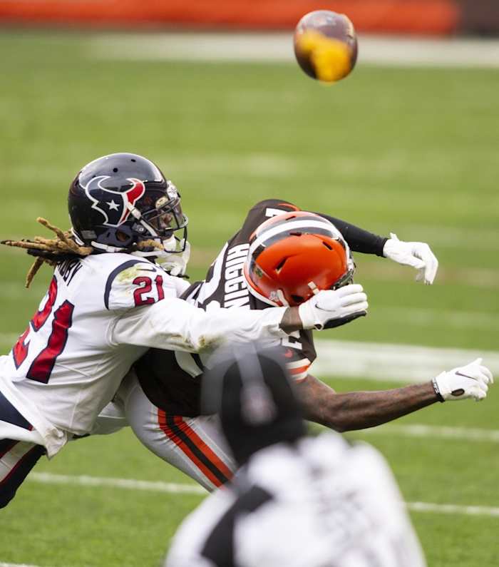 Houston Texans cornerback Bradley Roby (21) hits Cleveland Browns receiver Rashard Higgins (82). Mandatory Credit: Scott Galvin-USA TODAY Sports